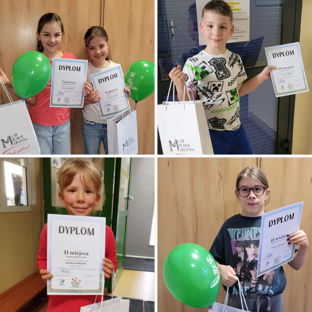 Część laureatów konkursu fotograficznego "Wiosna w obiektywie" pozuje z dyplomami oraz nagrodami